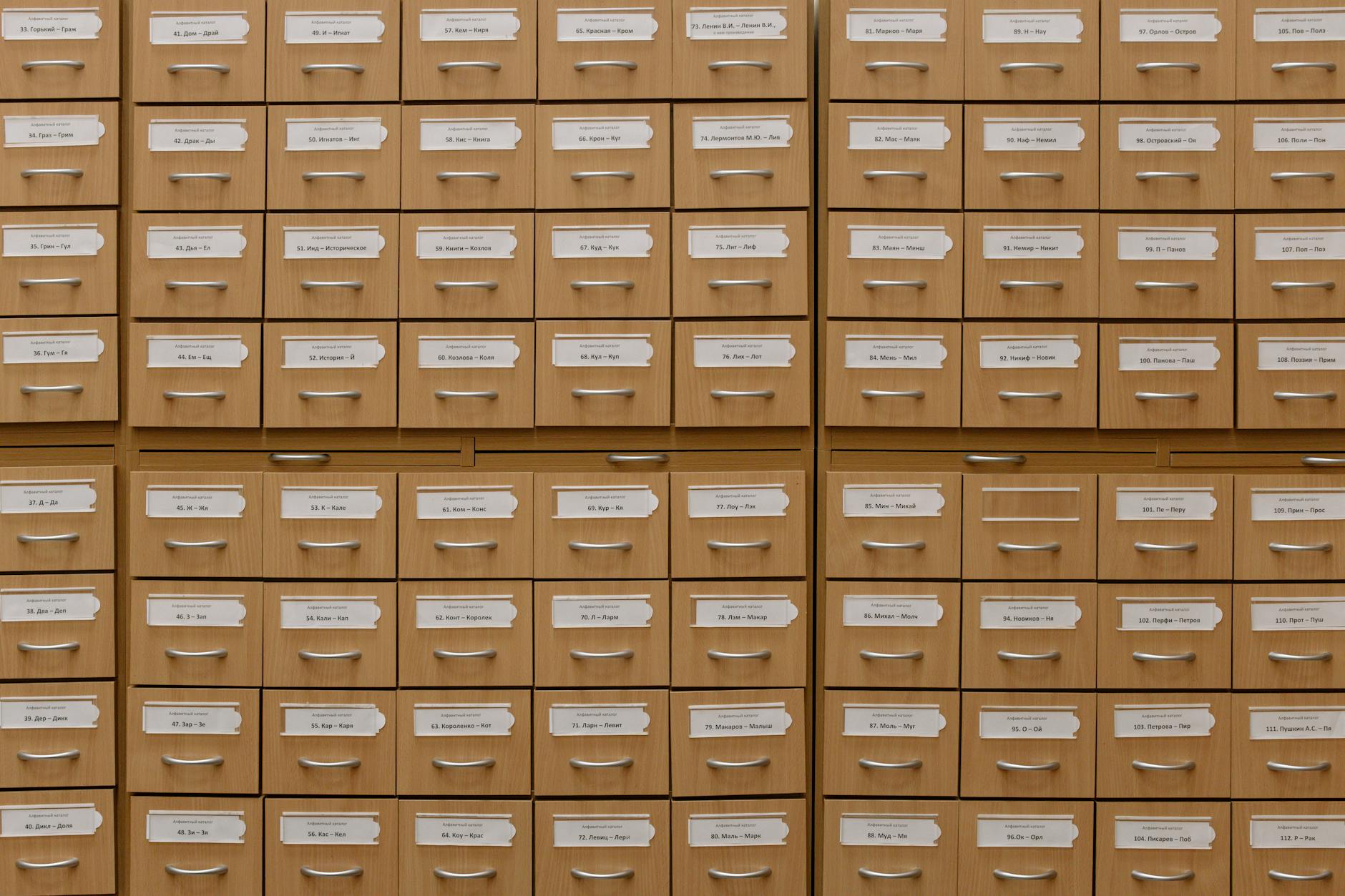 Close-up of labeled wooden storage drawers, perfect for organization concepts