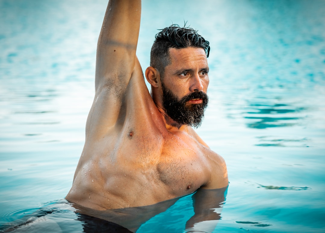 Male swimmer posing in the pool